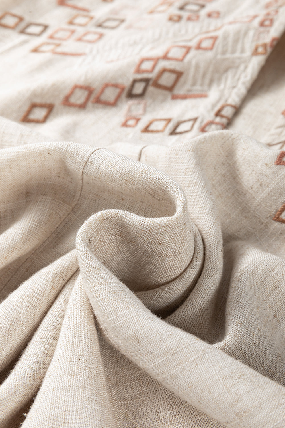 Jet Stream Geometric Embroidered Short Sleeve Tassel Tied V Neck Blouse