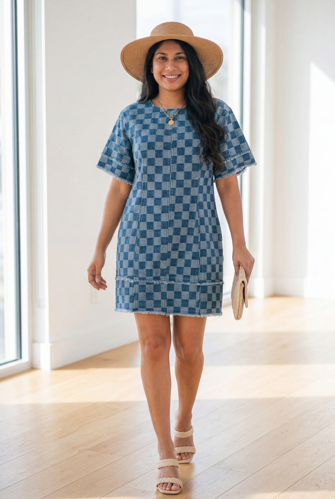 Errabelly blue checkered denim mini dress with frayed hem and patchwork details, worn by a woman outdoors.