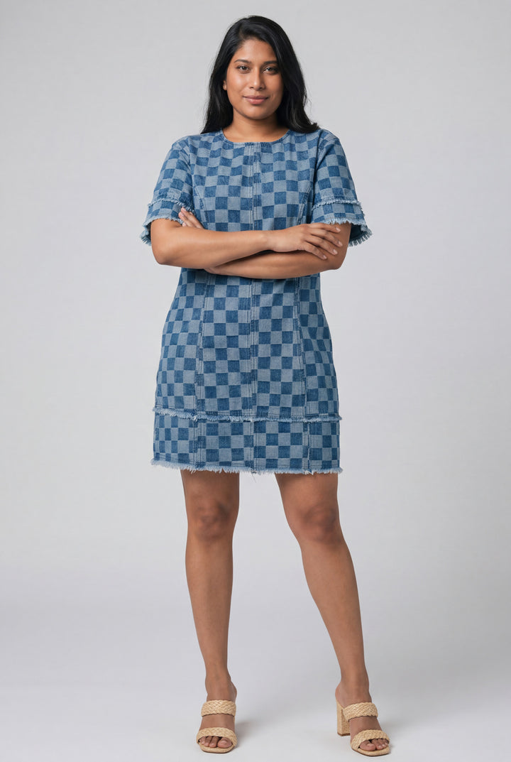 Errabelly blue checkered denim mini dress with frayed hem and patchwork details, worn by a woman outdoors.