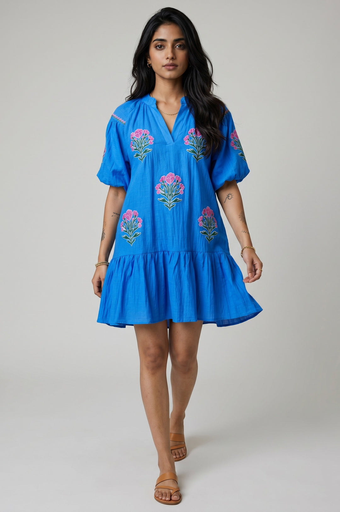 Errabelly blue short puff sleeve dress with pink floral embroidery and ruffle hem. Split neck.