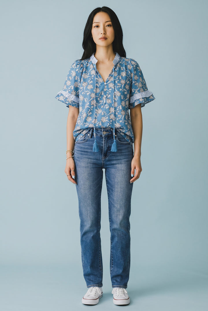Errabelly blue floral print short sleeve blouse with striped trim, tie neck, and button details.