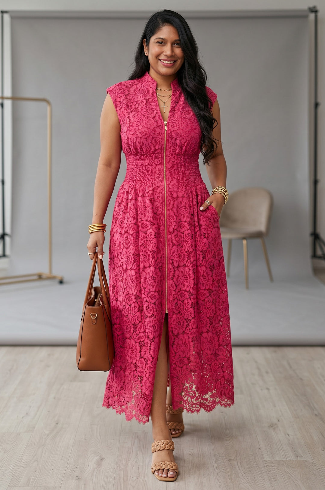 Errabelly sleeveless V-neck dress in coral floral lace with smocked waist and gold zipper. Side pockets and scalloped hem.
