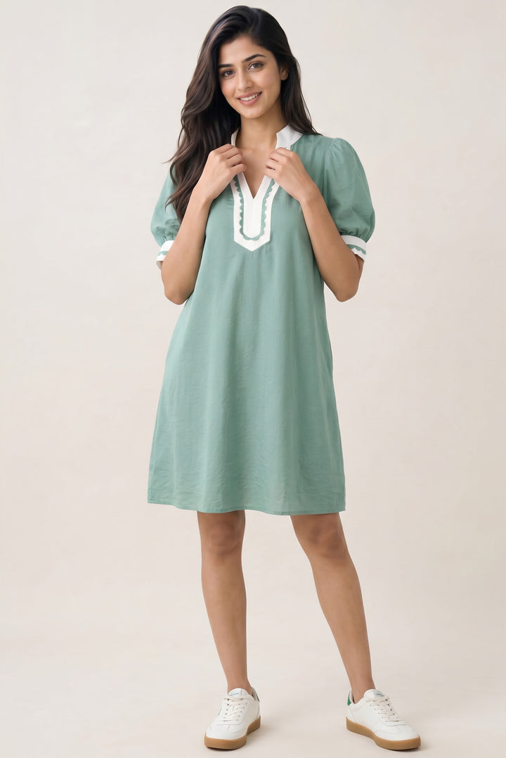 Errabelly green cotton-blend mini dress with white scalloped trim on the V-neck and puff sleeves.