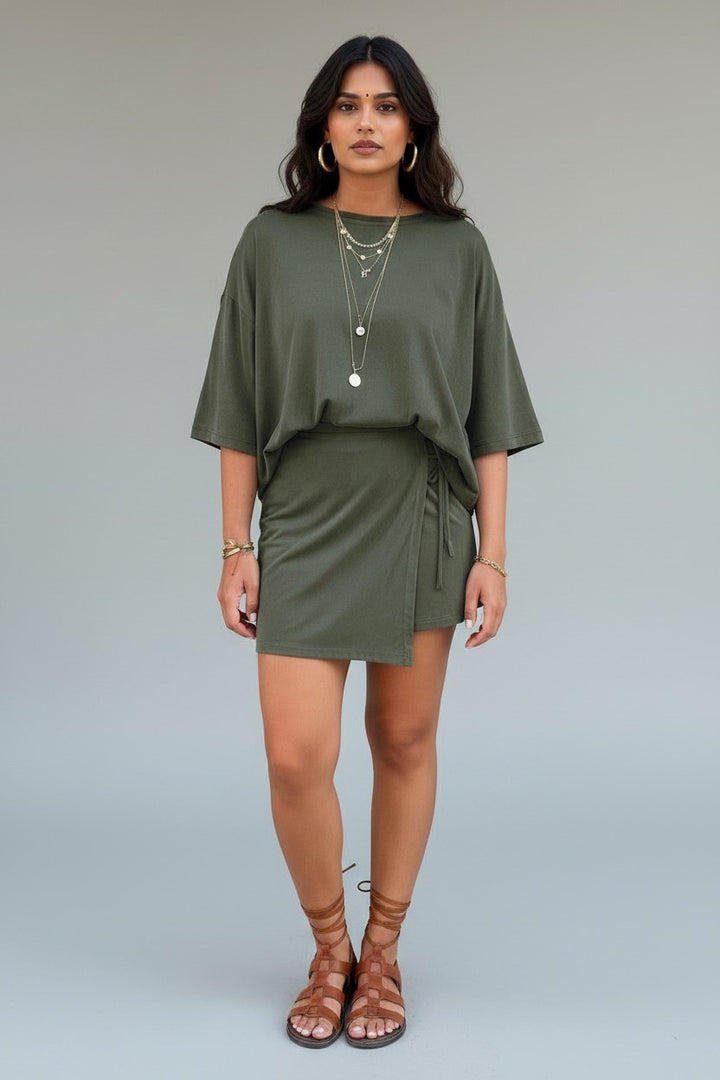 Errabelly olive green oversized tee and wrap tie mini skort set on a woman.