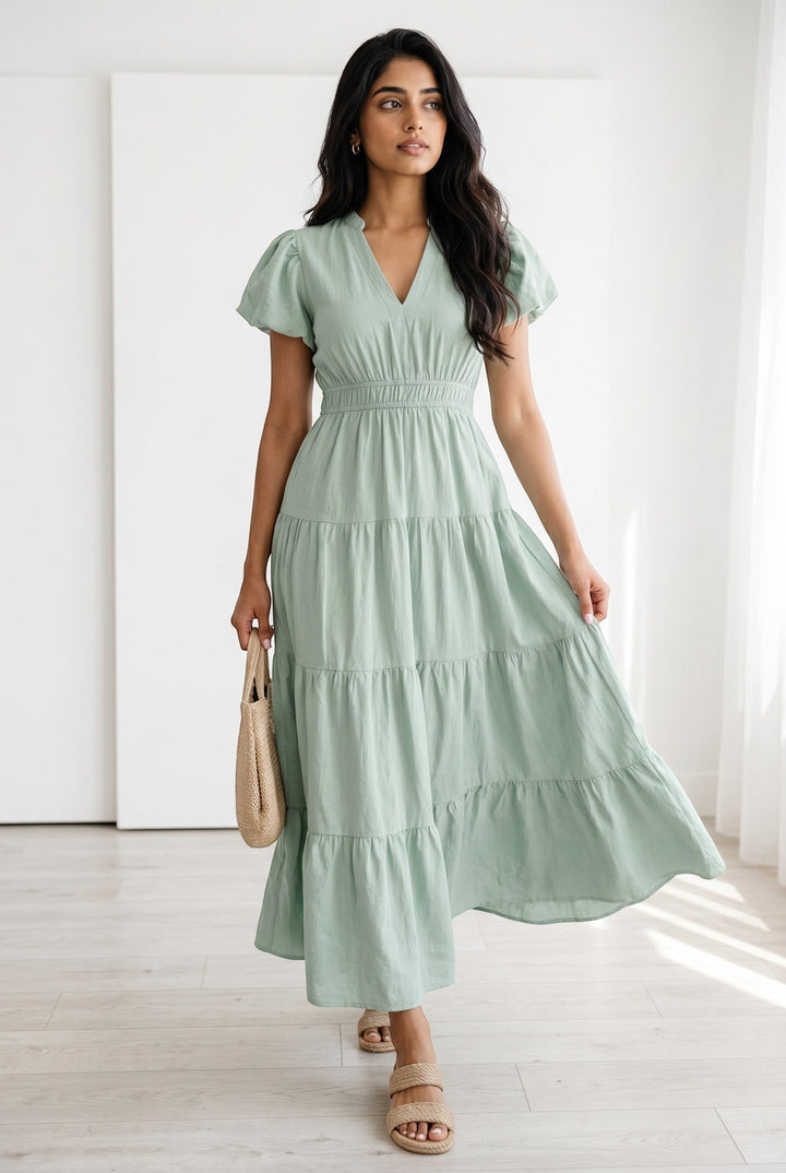 Errabelly light green V-neck puff sleeve tiered maxi dress with a high waist and flowing skirt.