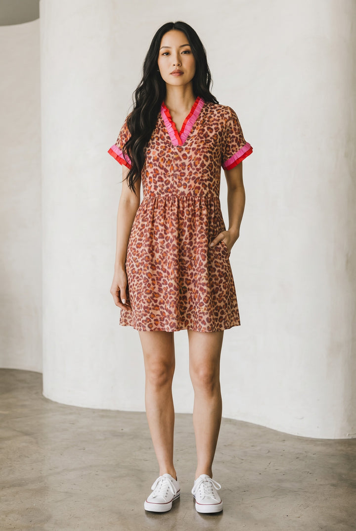 Errabelly short dress with leopard print, V-neck, ruffled trim in pink and coral, and short sleeves.