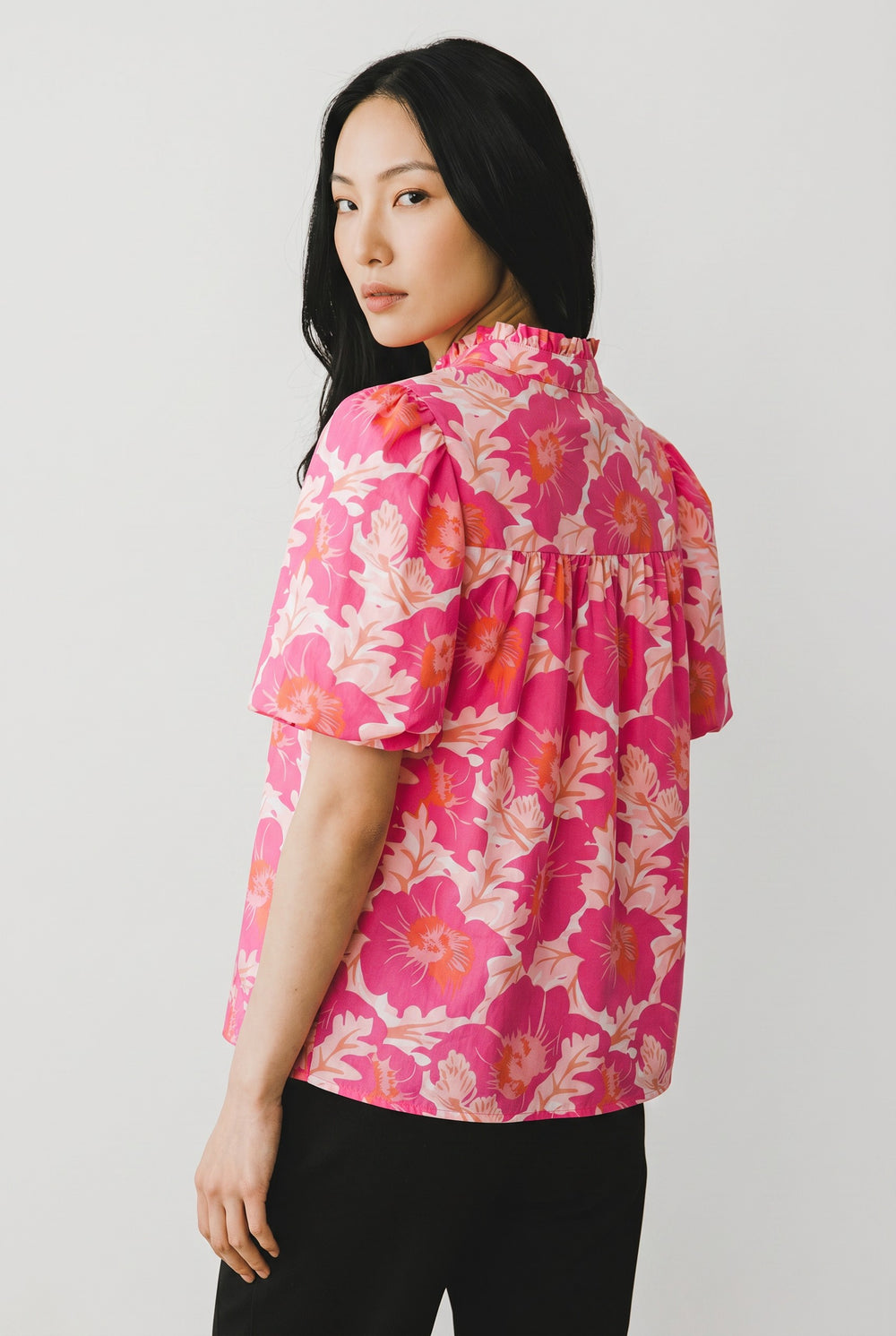 Errabelly pink floral print blouse with short bubble sleeves and a ruffled high neck. Lightweight summer top.