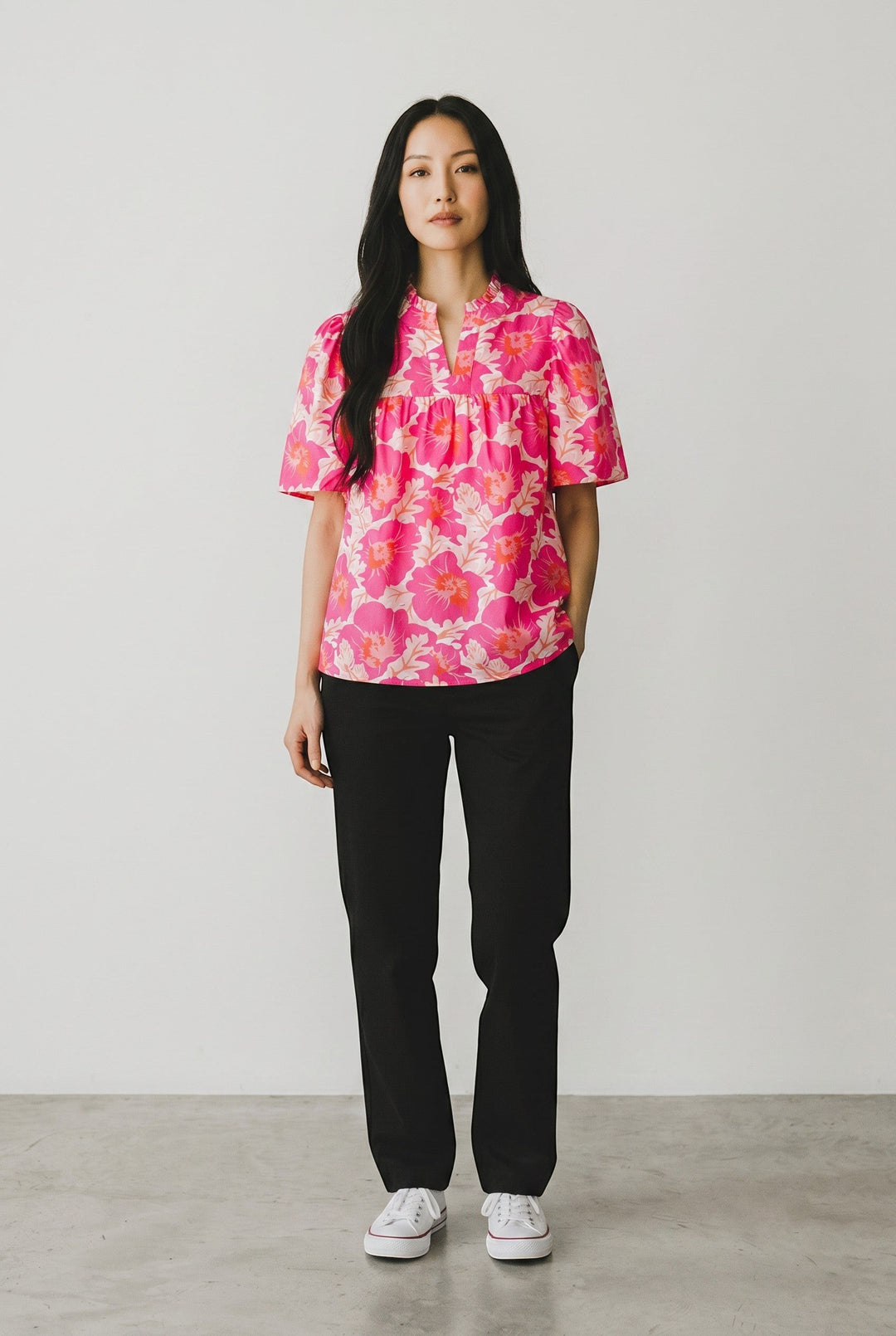 Errabelly pink floral print short bubble sleeve blouse with ruffled neckline and v-neck.