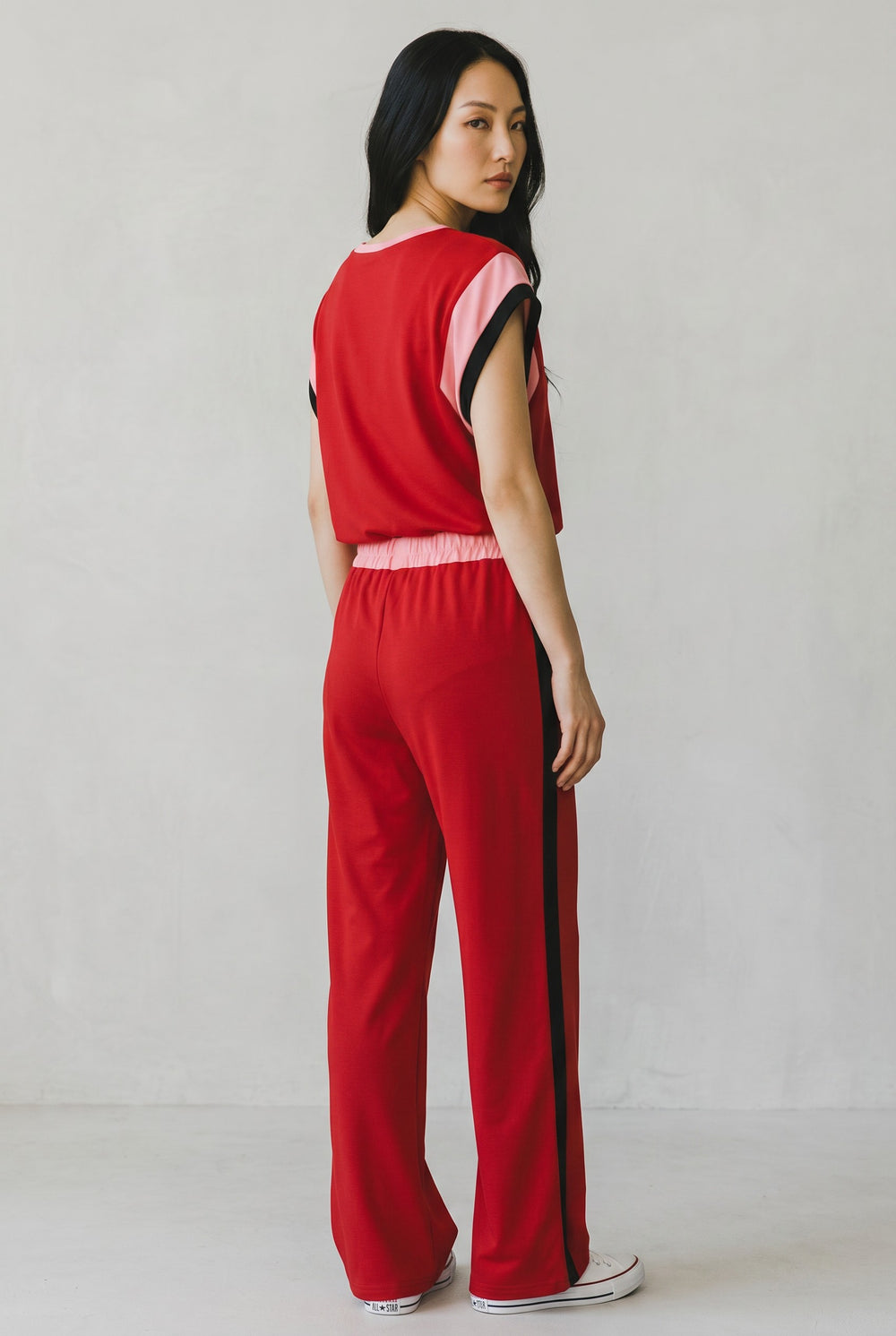Errabelly red two-piece set with pink and black color block detail on sleeves and side stripe on pants.