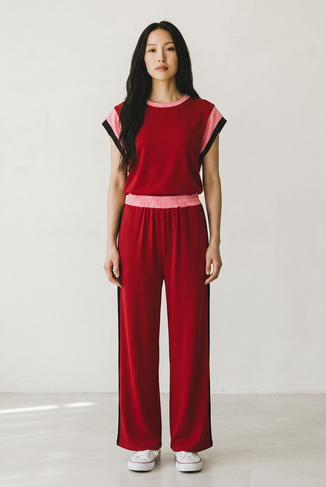 Errabelly red two-piece set with pink and black color block detail on sleeves and side of pants. Crew neck, cap sleeves, wide-leg pants.